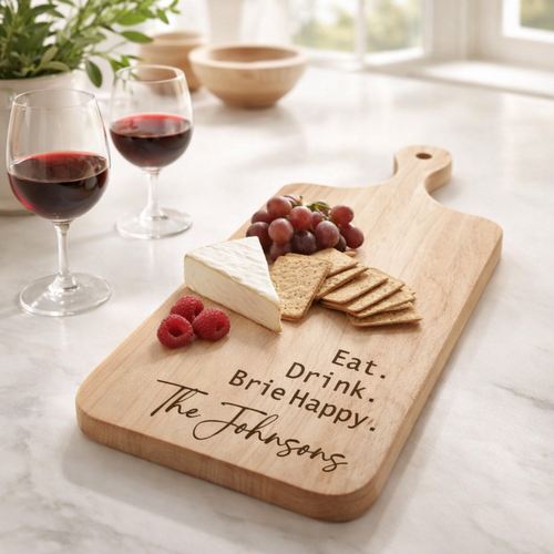 Maple Eat Drink Brie Happy cheese board arranged with cheese, crackers and red wine